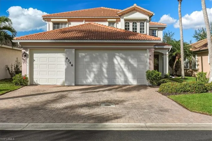 Mediterranean / spanish-style house featuring a tile roof, stucco siding, an attached garage, and driveway