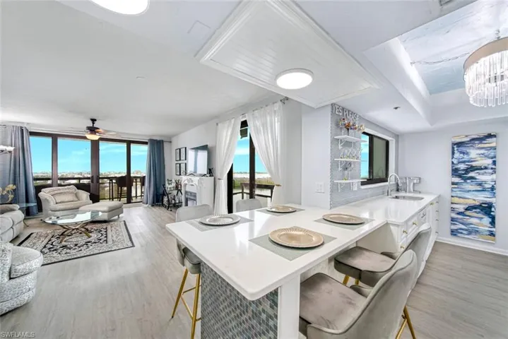 Light and bright open floor plan with new Hurricane sliding doors and windows, new flooring and spectacular water views from every room.