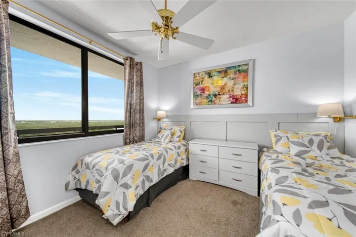 Guest bedroom featuring views of the back bay and canal