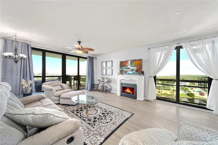 Living room featuring water views from all angles.