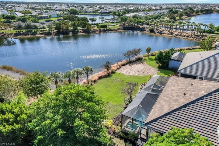 Aerial perspective of suburban area with a large body of water