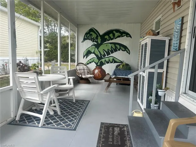 Sunroom / solarium featuring outdoor dining space