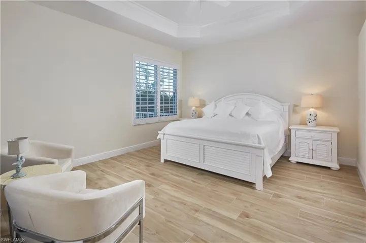 Spacious primary bedroom suite with lanai access.