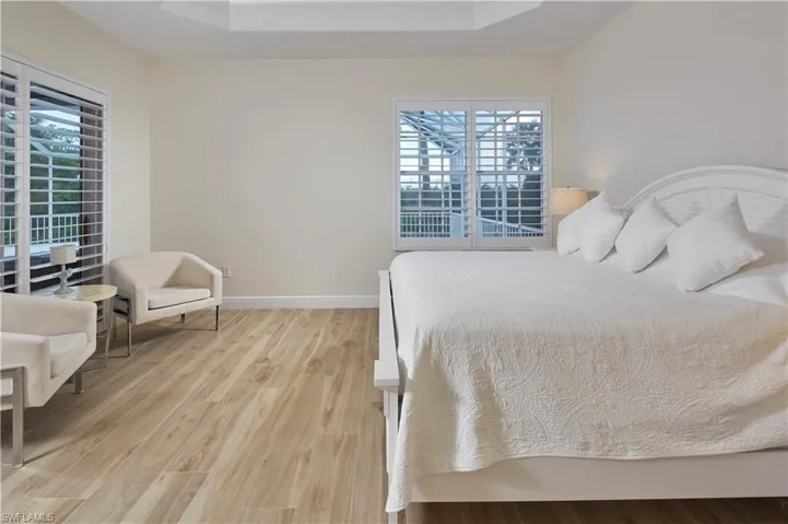 Notice the wood look PORCELAIN TILE flooring throughout the home.