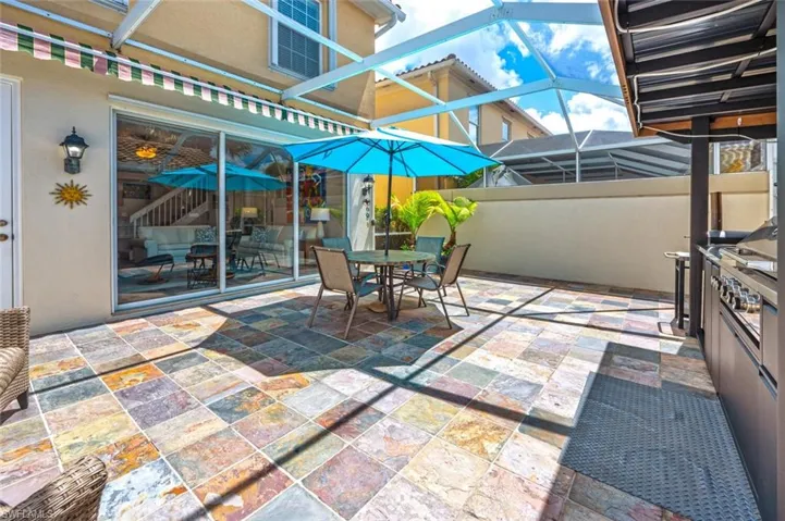 Screened in lanai with built in grilling area.