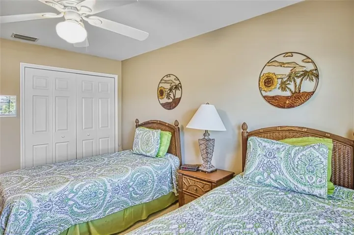 Bedroom featuring ceiling fan and a closet
