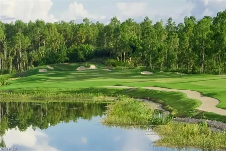 View of property's community featuring golf course view and a water view