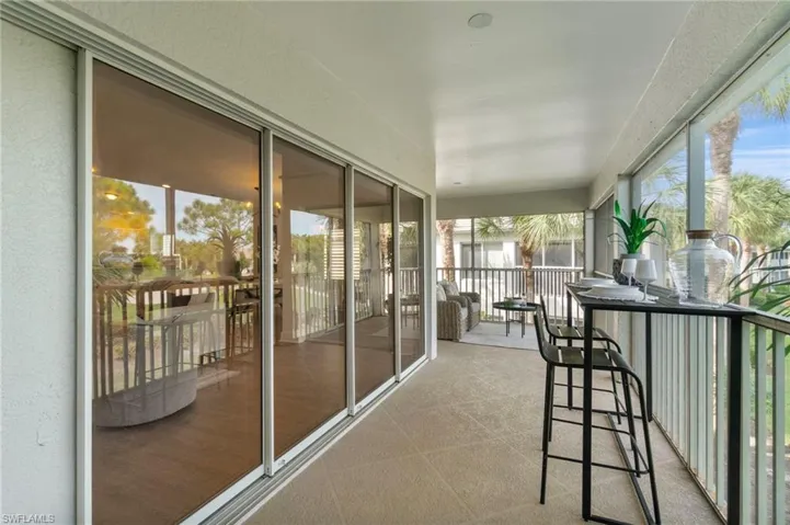 The wraparound screened in lanai is expansive in size and views featuring a 2 sets of sliders opening access to both the Great room and dining area..