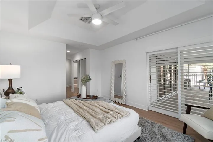 Custom Plantation shutters mask the private entry sliders to your lanai space