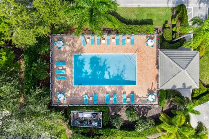 Drone / aerial view of community pool area - just steps from the units front door.