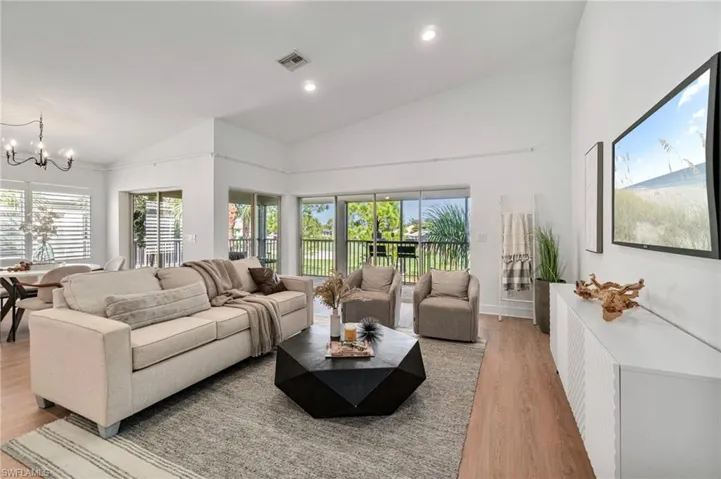 Abundantly filled with natural light the living area looks out over beautiful green golf course.