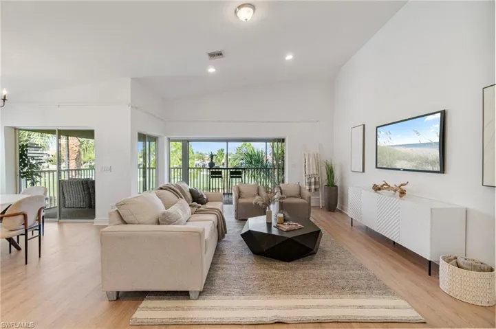 Great room is open, light and bright with fresh paint and new light wood look LVP flooring.
