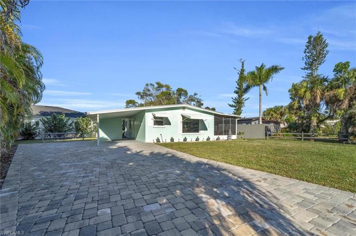 Oversized Paver Driveway, Carport and Firepit (back left)