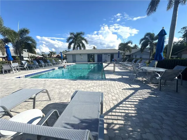 Community pool featuring a patio area