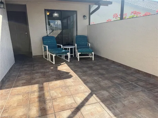 Private entry patio that is screened