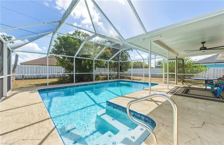 Ranch-style home with an attached garage, stucco siding, concrete driveway, and a shingled roof
