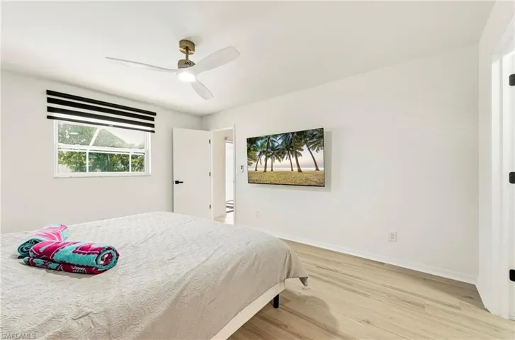 Bedroom featuring light wood finished floors and a ceiling fan