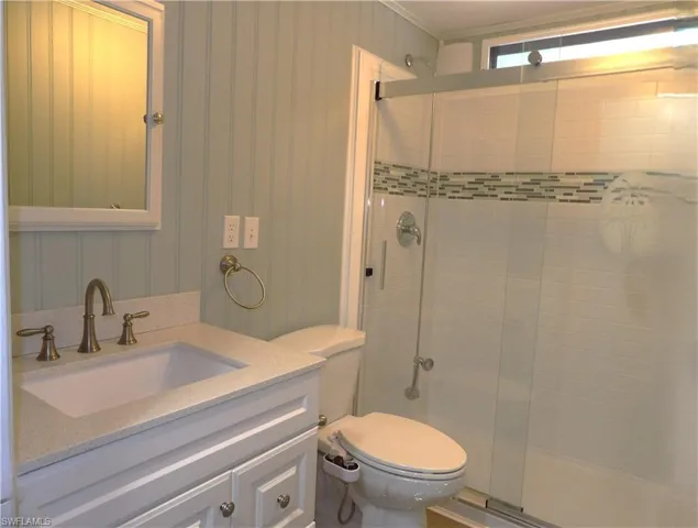 Full bath with vanity, bidet and a stall shower