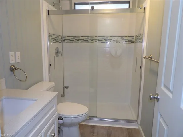 2nd picture showing the main bathroom with vanity, bidet, and full view of the shower