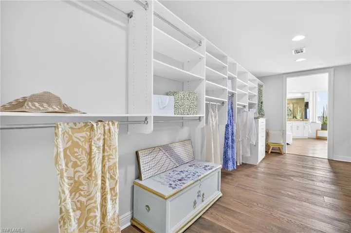 Primary Suite Closet leading to Primary Bath