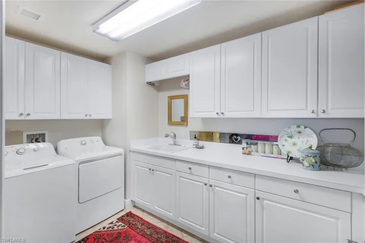 Huge laundry with sink off the Kitchen.  Can be used extra prep space.