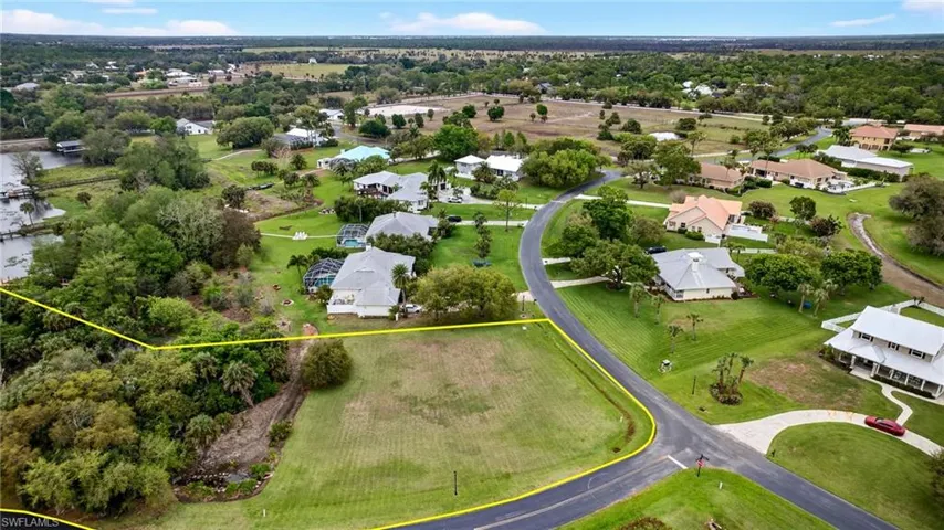 Aerial perspective of suburban area featuring property parcel outlined