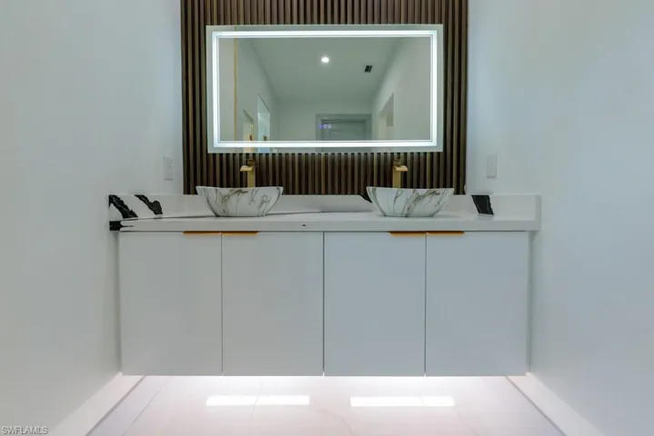 Bathroom featuring double vanity