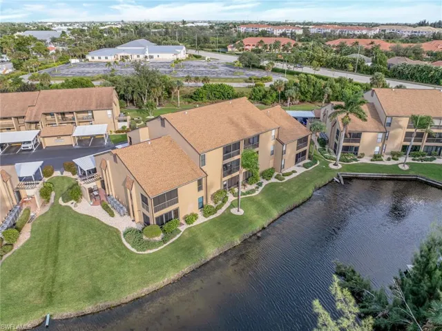 Bird's eye view of a nearby body of water and apartment complex / building