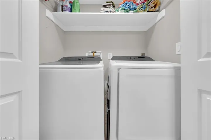 Laundry room with washing machine and dryer
