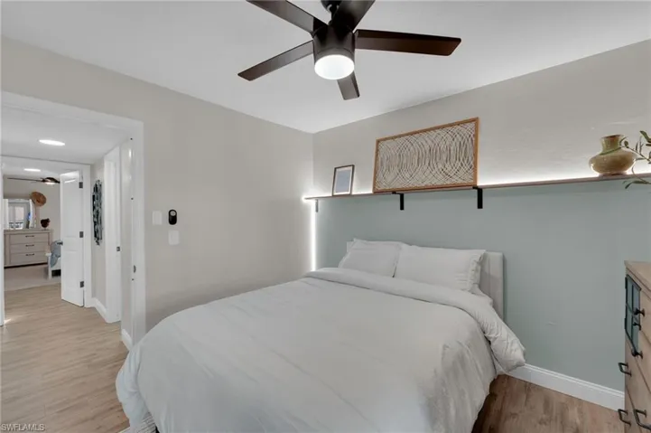 Bedroom with light wood-style flooring and ceiling fan