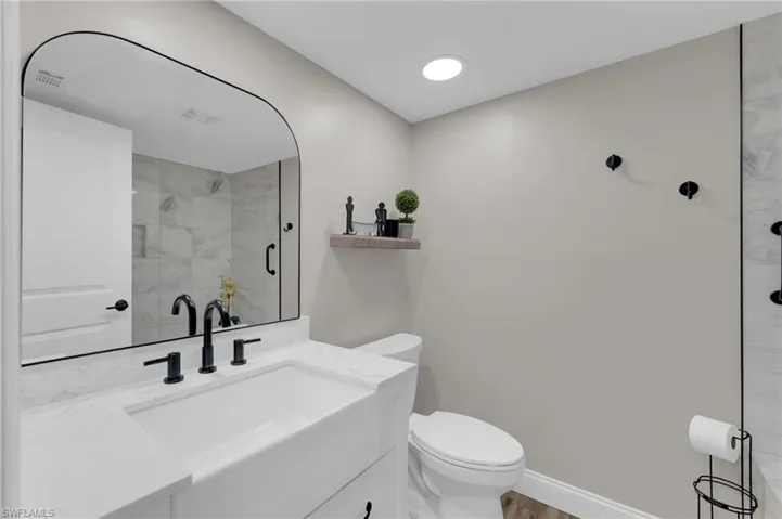 Bathroom featuring vanity and a shower