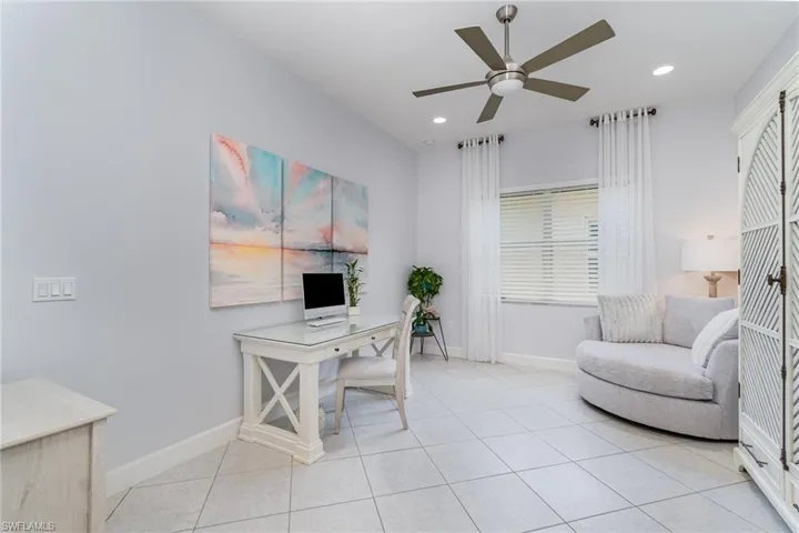 Office or Den area with a ceiling fan, light tile flooring, and recessed lighting.