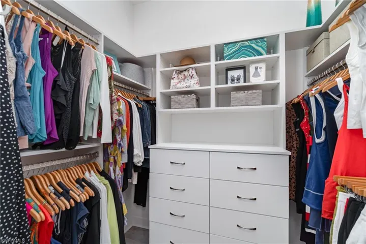 Primary designer closet number 1 with built-in shelving for organization.
