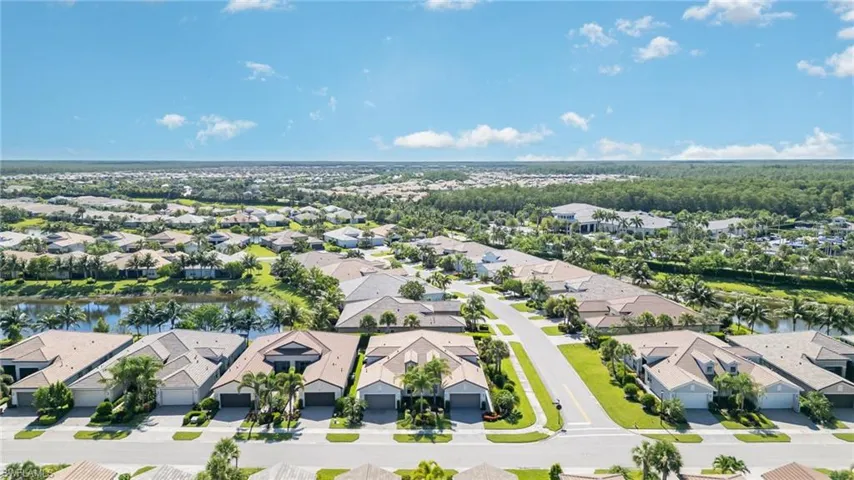 Aerial view of the home and neighborhood. Clubhouse and pool are to the back right and are a short walk from the home.