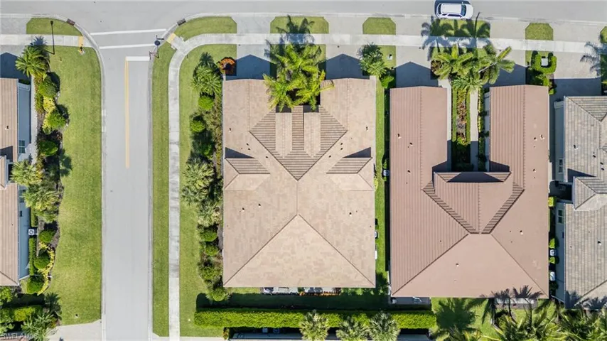 Aerial view of home with tiles roof. Clean and well maintained.