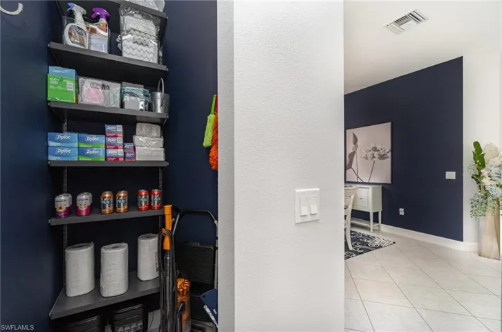 View of hall closet with new shelving.