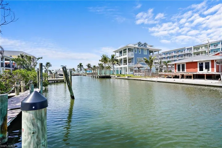 View up the canal toward Ft Myers Beach. The property has a very nice composite dock   THIS IS NOT THE DOCK on the property in the picture it is a neighboring dock.