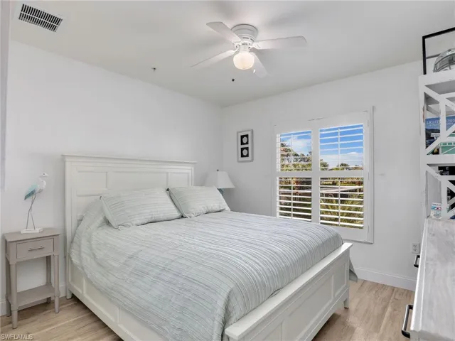 Bedroom featuring ceiling fan and light hardwood / wood-style flooring