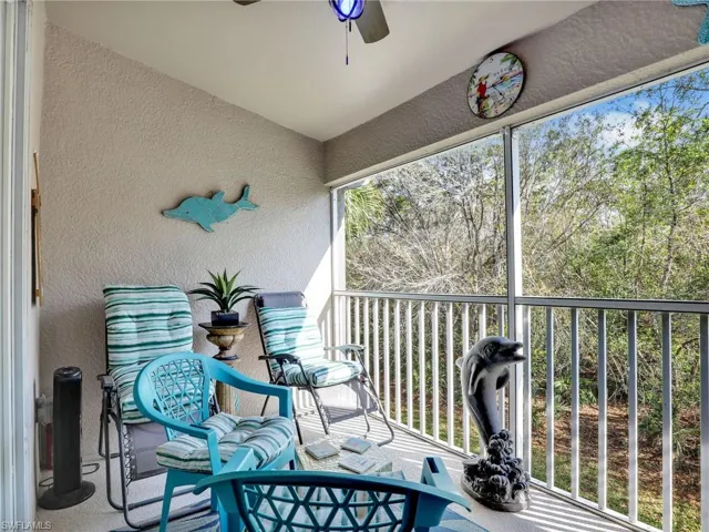 Sunroom / solarium featuring ceiling fan