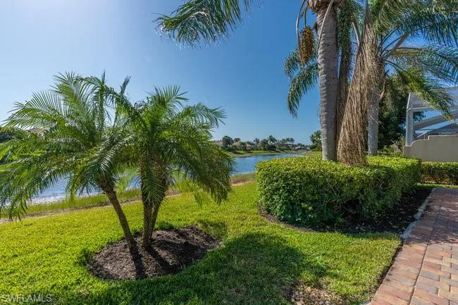 View of yard with a water view