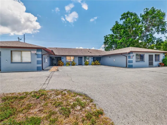 Multi-unit property with a large asphalt parking area