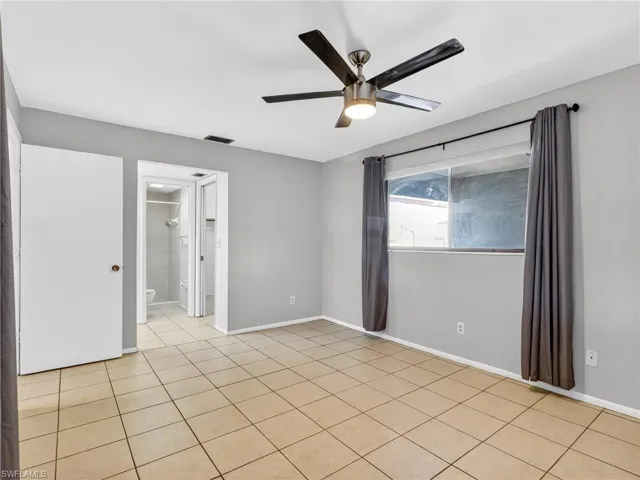 Neutral wall paint colors complement the tile flooring