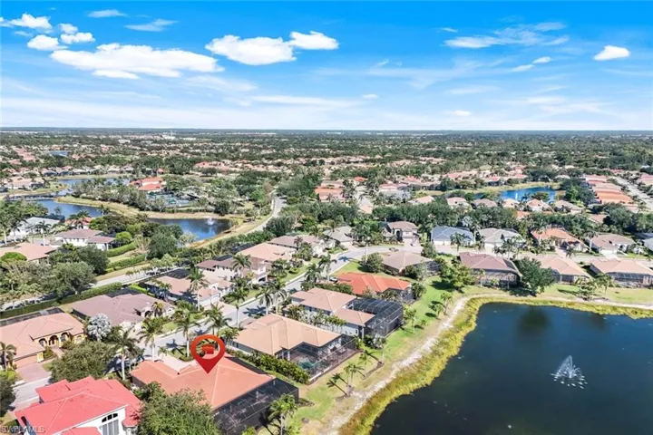 Aerial perspective of suburban area with a nearby body of water