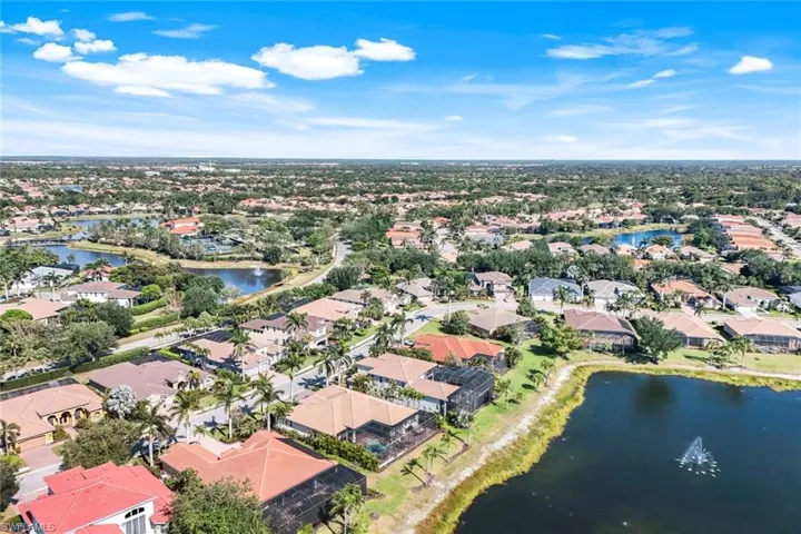 Aerial perspective of suburban area featuring a large body of water