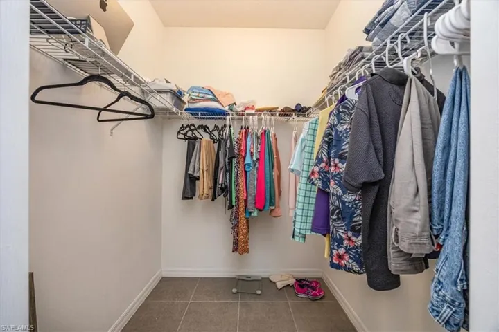 Spacious closet with tile patterned floors