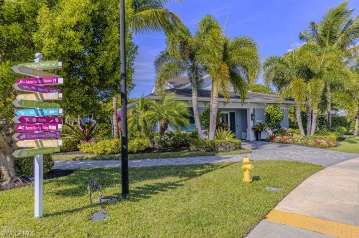 View of front of house with a front yard and driveway