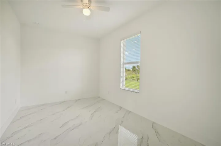 Spare room featuring ceiling fan