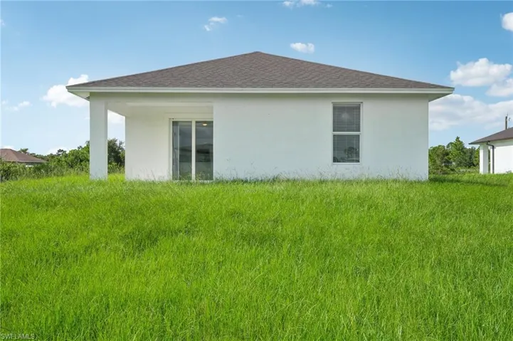 View of home's exterior with a lawn