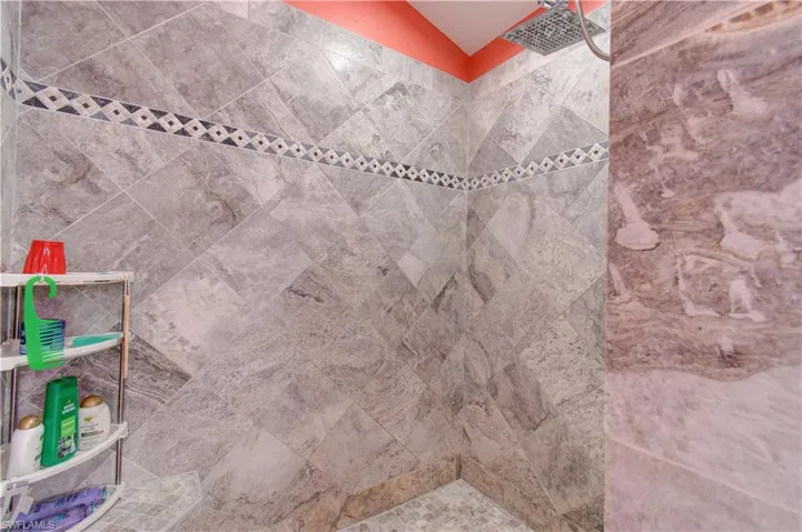 Bathroom view of a tile shower