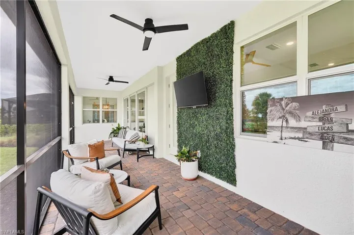 Sunroom featuring ceiling fan